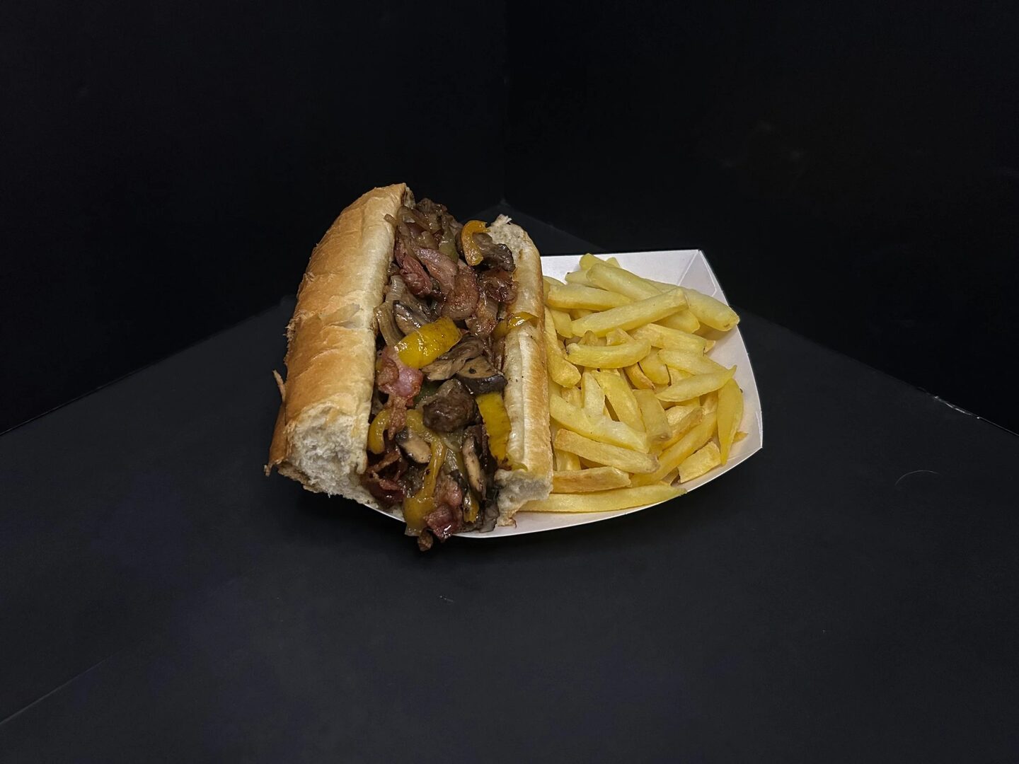 Philly's Cousins steak sandwiches with melted cheese, peppers, and onions.